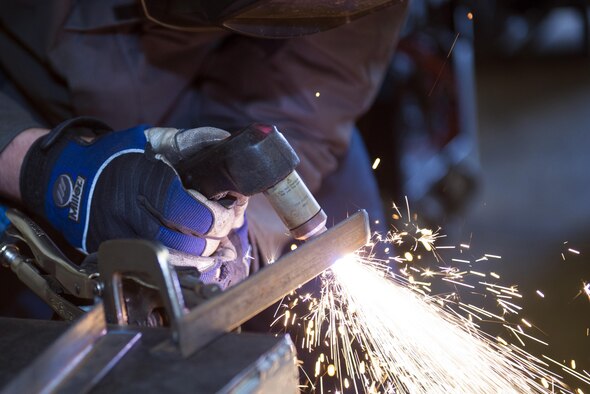 U.S. Air Force Airman 1st Class Joshua Tears-Knapp, 23d Equipment Maintenance Squadron aircraft metals technology journeyman, uses a plasma cutter to weld a piece of metal, March 18, 2016, at Moody Air Force Base, Ga. Metals technology technicians are responsible for fabricating and repairing aircraft parts and equipment. (U.S. Air Force photo by Airman 1st Class Greg Nash/Released) 