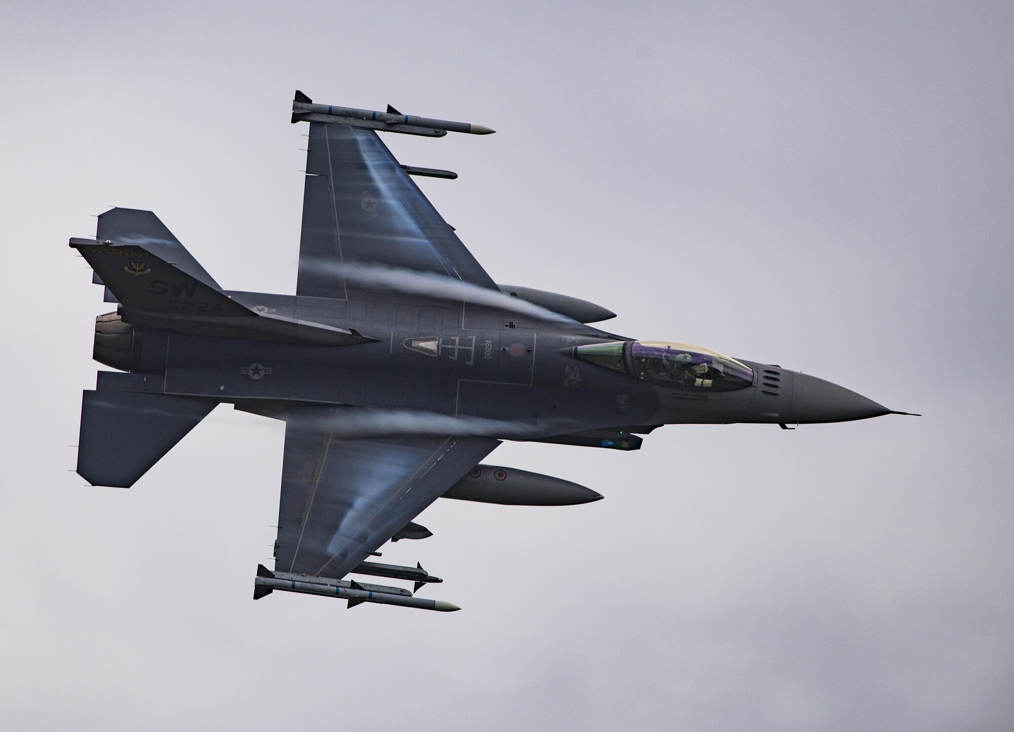 An F-16 Fighting Falcon soars above Grand Bay Bombing and Gunnery Range at Moody Air Force Base, Ga., May 20, 2016. Airmen simulated different combat situations to synchronize efforts between a variety of Air Combat Command airframes. (U.S. Air Force photo by Airman Daniel Snider/Released)