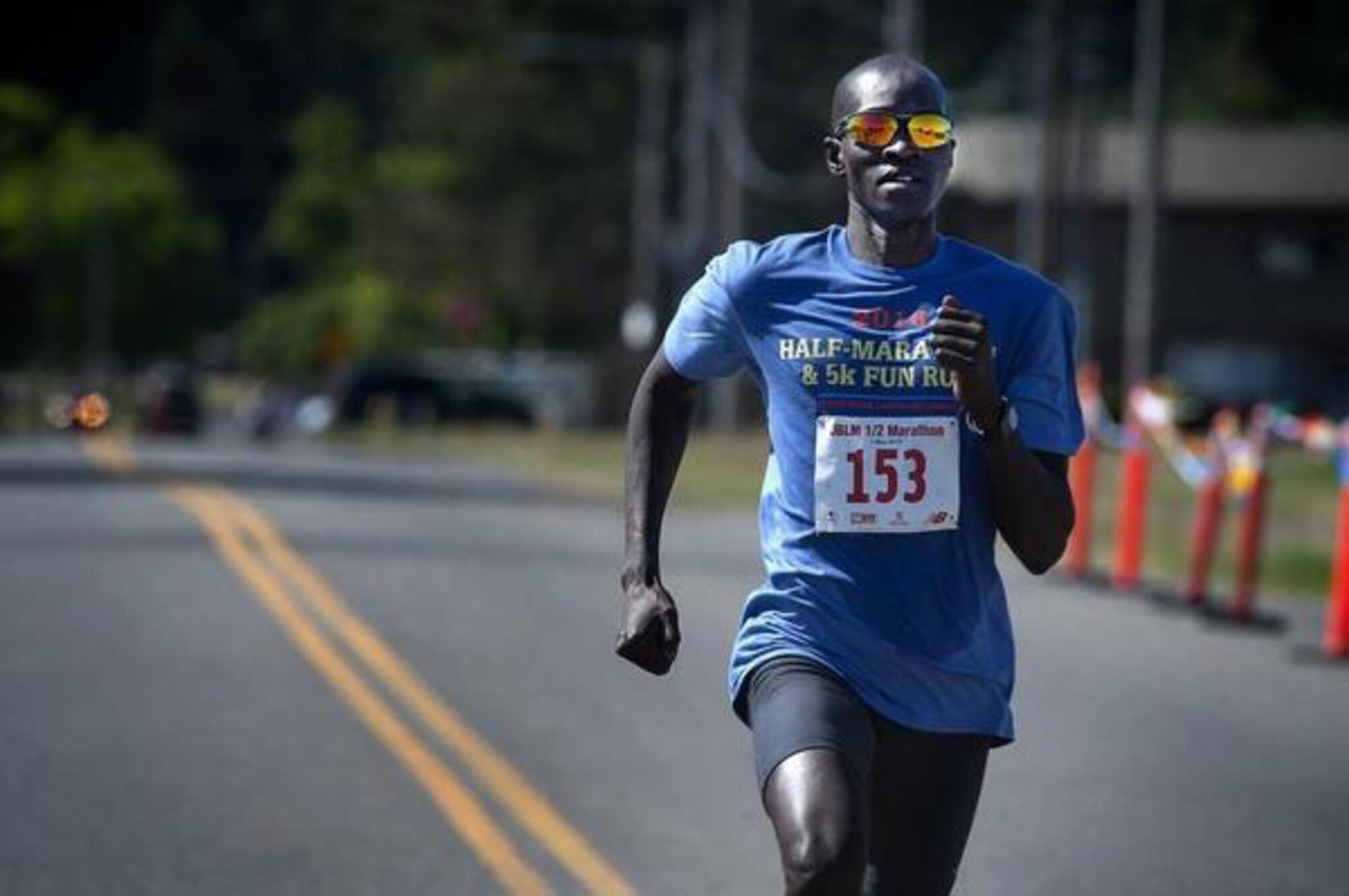 Half-Marathon overall winner Dominic Luka nears the finish line during the JBLM Half-Marathon and 5K Fun Run on Lewis Main May 21.