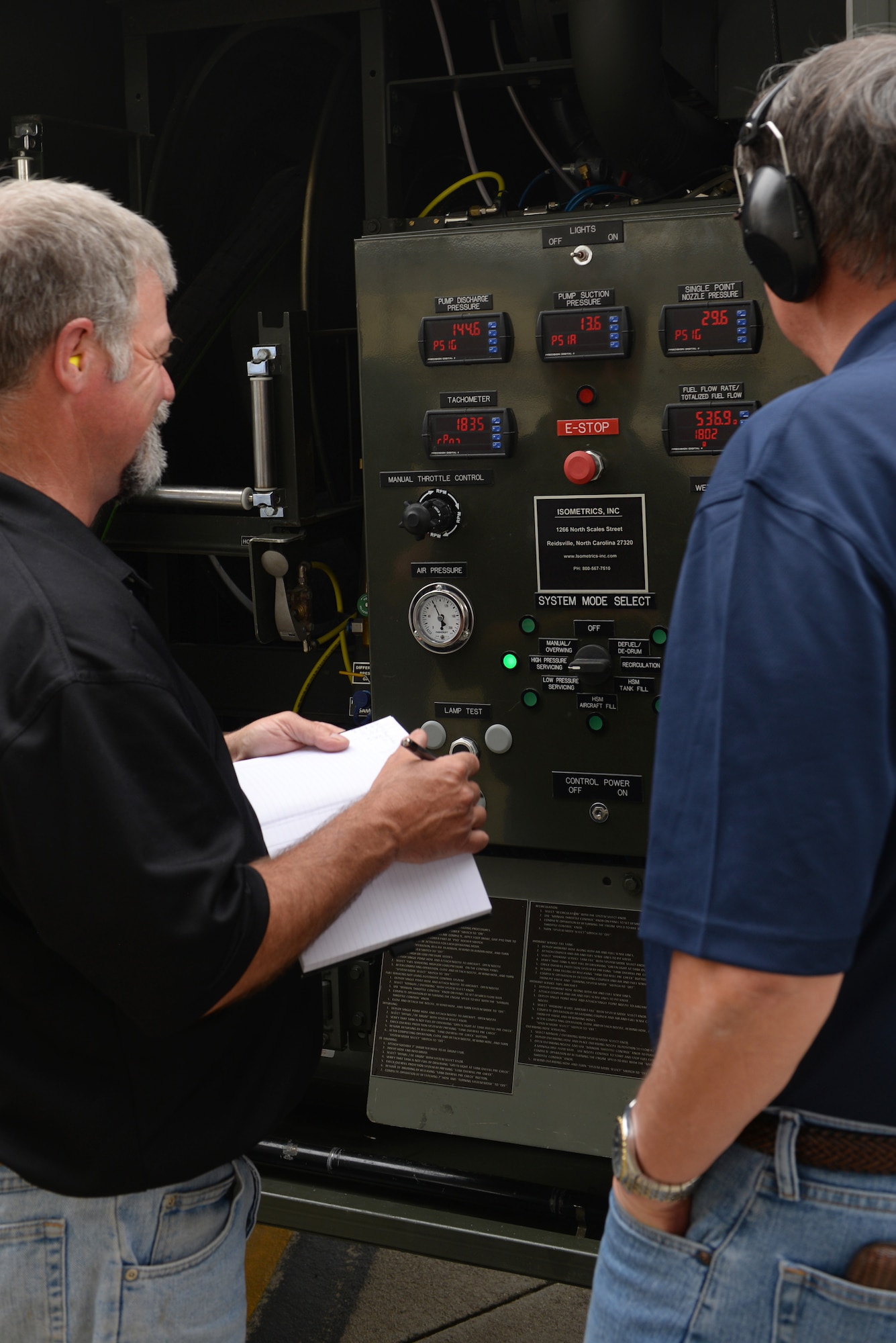 Mike Nelson (left), Air Force Petroleum Agency operations director, and Greg Clay (right), AFPET liaison for Warner Robins Depot, survey gauges on the new Isometrics R-11 Refueler’s panel, May 17, 2016, at Seymour Johnson Air Force Base, North Carolina. The high and low pressure levels were tested and tracked while refueling F-15E Strike Eagles and KC-135 Stratotankers. (U.S. Air Force photo by Airman 1st Class Ashley Williamson)