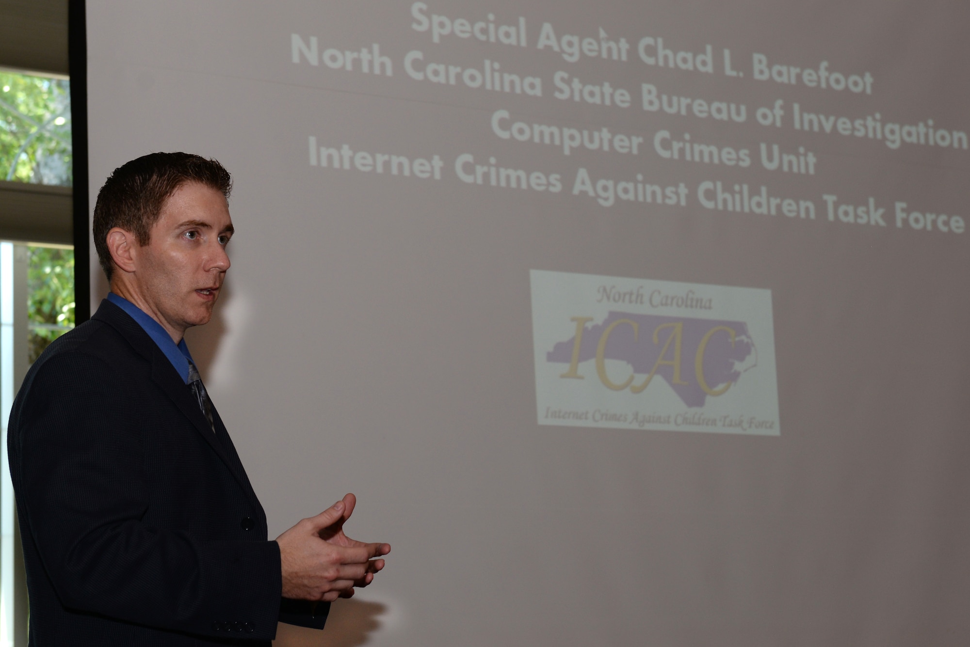 Special Agent Chad Barefoot, assigned to the Southeastern District of North Carolina State Bureau of Investigation, hosts a presentation about internet safety, May 24, 2016, at Seymour Johnson Air Force Base, North Carolina. Barefoot discussed how vulnerable children are to cyberbullying, online predators and sexting. (U.S. Air Force photo by Airman 1st Class Ashley Williamson/Released)