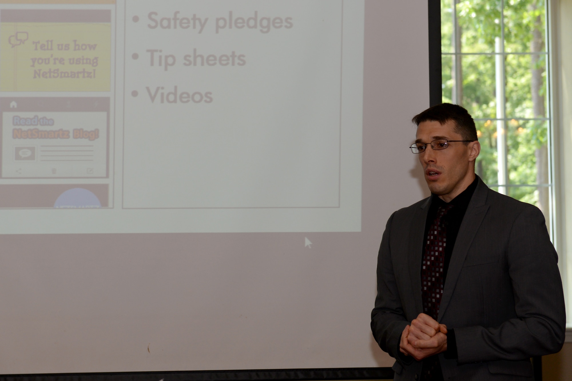 Anthony Sandoval, Air Force Office of Special Investigations Detachment 216 special agent, discusses the progression and dangers of technology during a brief, May 24, 2016, at Seymour Johnson Air Force Base, North Carolina. Sandoval spoke about how much technology has advanced in the last 30 years and increased the threat of wrongful internet usage to children. (U.S. Air Force photo by Airman 1st Class Ashley Williamson/Released)
