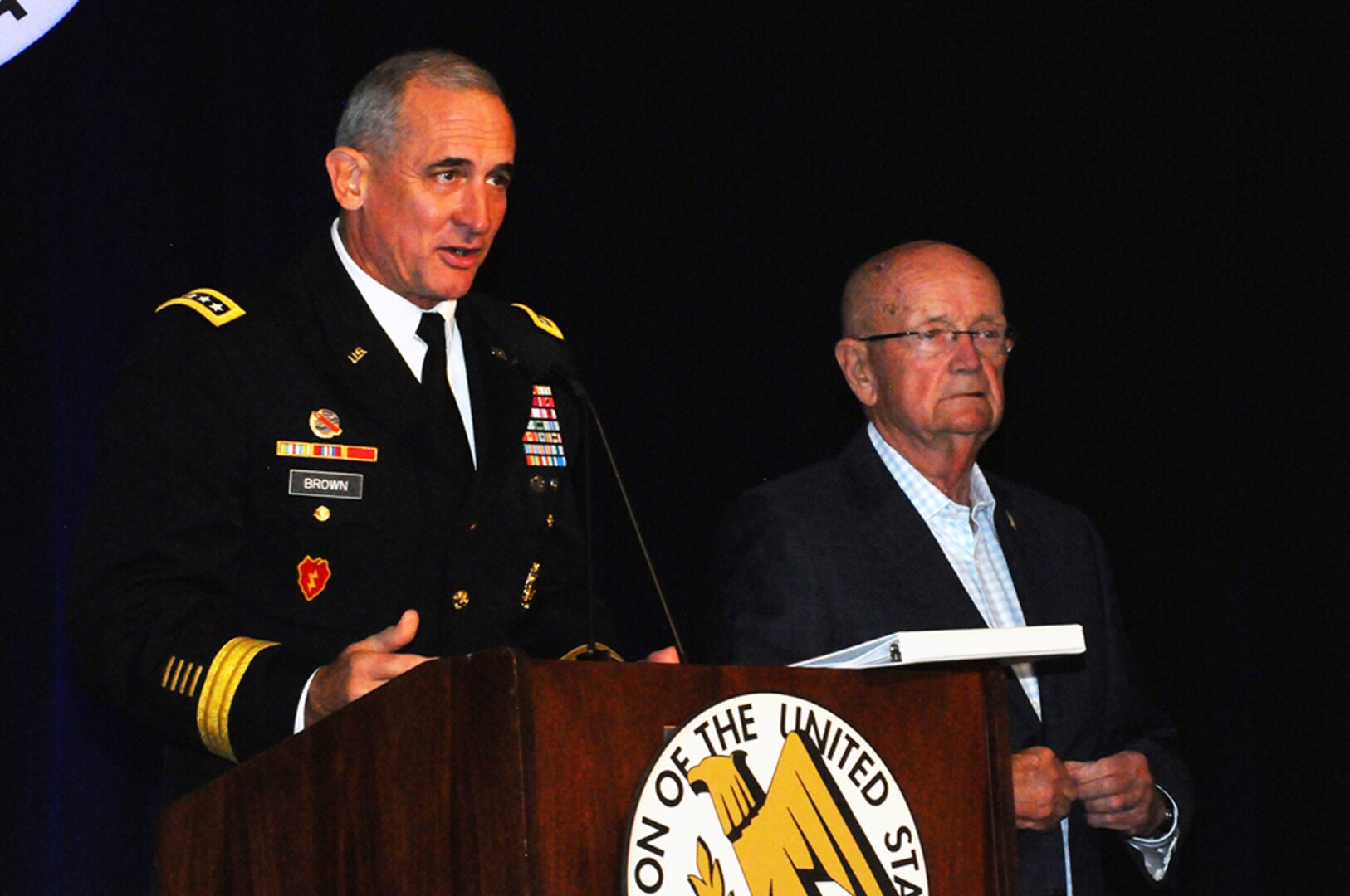 HONOLULU, Hawaii (May 25, 2016) - Gen. Robert B. Brown (left) honors Association of the United States Army President, retired U.S. Army Gen. Gordon R. Sullivan, for his 56 years of public service, which include over three decades of active duty service in the Army. LANPAC 2016 will be Sullivan's last symposium as he prepares to step down as AUSA President. 