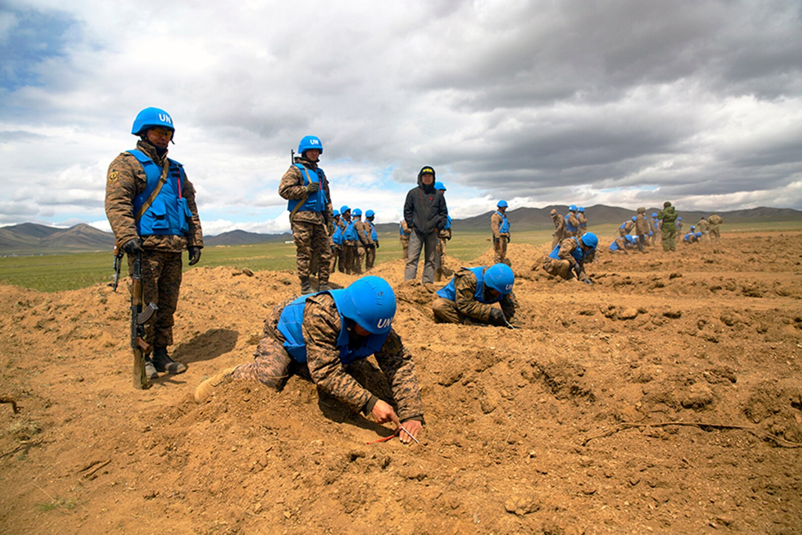 Members of the Mongolian Armed Forces participate in minefield self-extraction training during Khaan Quest 2016 at Five Hills Training Area near Ulaanbaatar, Mongolia. The training provided MAF members with the skills to safely identify and mark potential threats in a minefield. Khaan Quest 2016 is an annual, multinational peacekeeping operations exercise hosted by the Mongolian Armed Forces, co-sponsored by U.S. Pacific Command, and supported by U.S. Army Pacific and U.S. Marine Corps Forces, Pacific. Khaan Quest, in its 14th iteration, is the capstone exercise for this year’s Global Peace Operations Initiative program. The exercise focuses on training activities to enhance international interoperability, develop peacekeeping capabilities, build to mil-to-mil relationships, and enhance military readiness. 