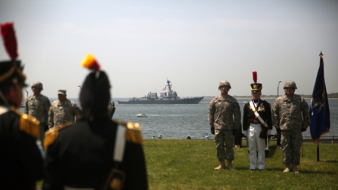 U.S. Army soldiers stationed at Fort Hamilton, Brooklyn, New York, stand at attention as U.S. Navy and U.S. Coast Guard ships enter the city’s harbor during the Parade of Ships, May 25, 2016. The Parade of Ships marks the beginning of the 28th Annual Fleet Week New York.