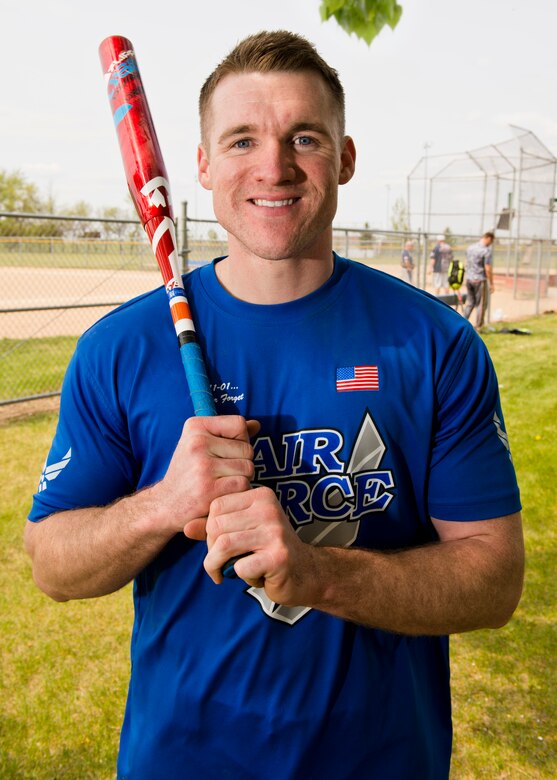 Staff Sgt. John Allen, 319th Communications Squadron high frequency global communications system operations manager, grips a bat during a portrait May 20, 2016, at Roosevelt Park in Devils Lake, N.D. Allen was recently named 2015 Air Force Male Athlete of the Year. (U.S. Air Force photo by Airman 1st Class J.T. Armstrong/Released)
