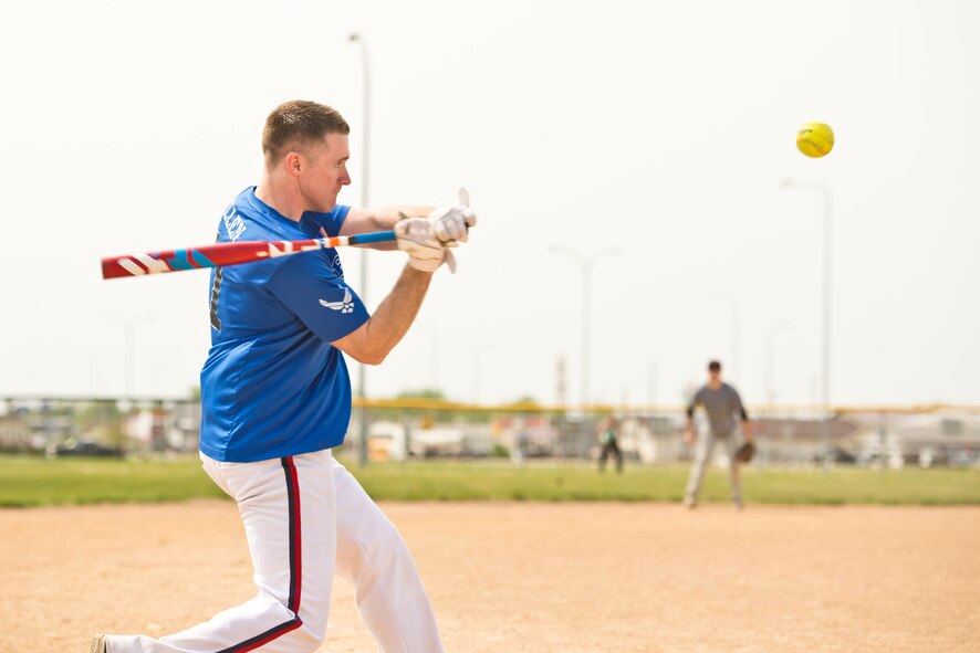Staff Sgt. John Allen, 319th Communications Squadron high frequency global communications system operations manager, eyes the ball during the second annual Grand Forks Air Force Base vs. Minot AFB softball tournament May 20, 2016, at Roosevelt Park in Devils Lake, N.D. Allen helped lead Grand Forks AFB to an 18-4 victory. (U.S. Air Force photo by Airman 1st Class J.T. Armstrong/Released)