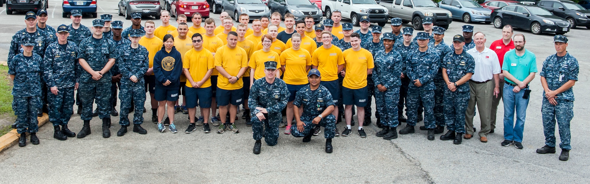 Sailors of the Naval Nuclear Power Training Unit Charleston community service division pose for a group photo with members of the Lowcountry Food Bank and the American Red Cross May 20, 2016, at Joint Base Charleston, S.C. More than 100 sailors transitioning through the community service division have volunteered nearly 10,000 hours in support of local nonprofit organizations since the program began October 2015. The program, created for sailors on hold from NPTU, awaiting orders due to medical, legal or other reasons, provides the opportunity to give back to the local community while resolving personal matters. The Lowcountry Food Bank and the American Red Cross presented the organization with letters of appreciation. (U.S. Air Force photo/Staff Sgt. Jared Trimarchi) 