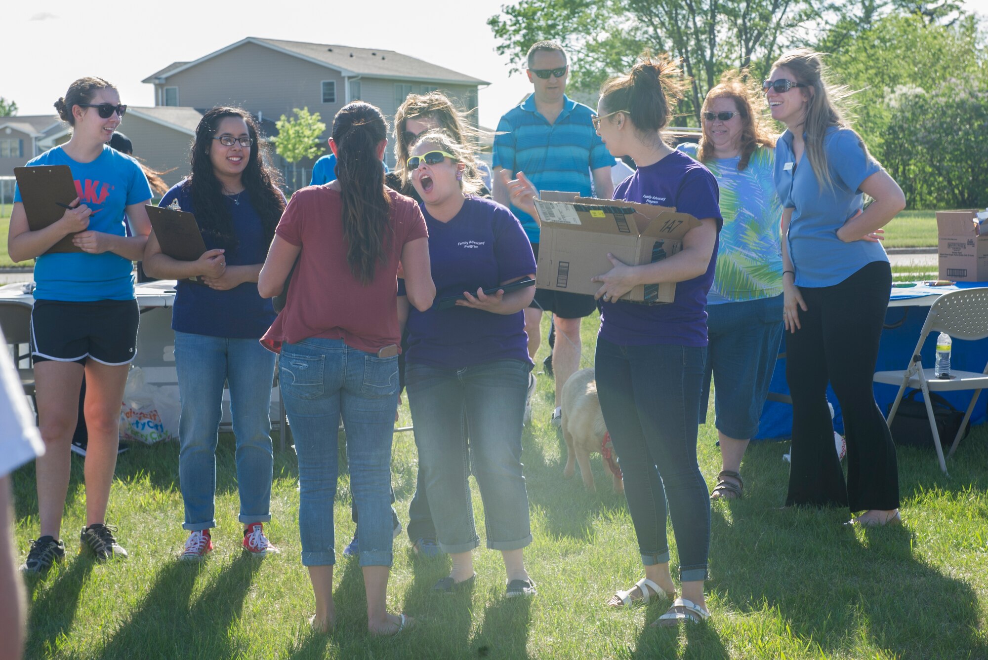 Airman 1st Class Izabella Sullivan and her dog Scooter accept their prize for “Smallest Dog” during the Shaggy Shuffle at Minot Air Force Base, N.D., May 24, 2016. The second-annual Shaggy Shuffle was an event to raise awareness for pet abuse. (U.S. Air Force photo/Senior Airman Apryl Hall)