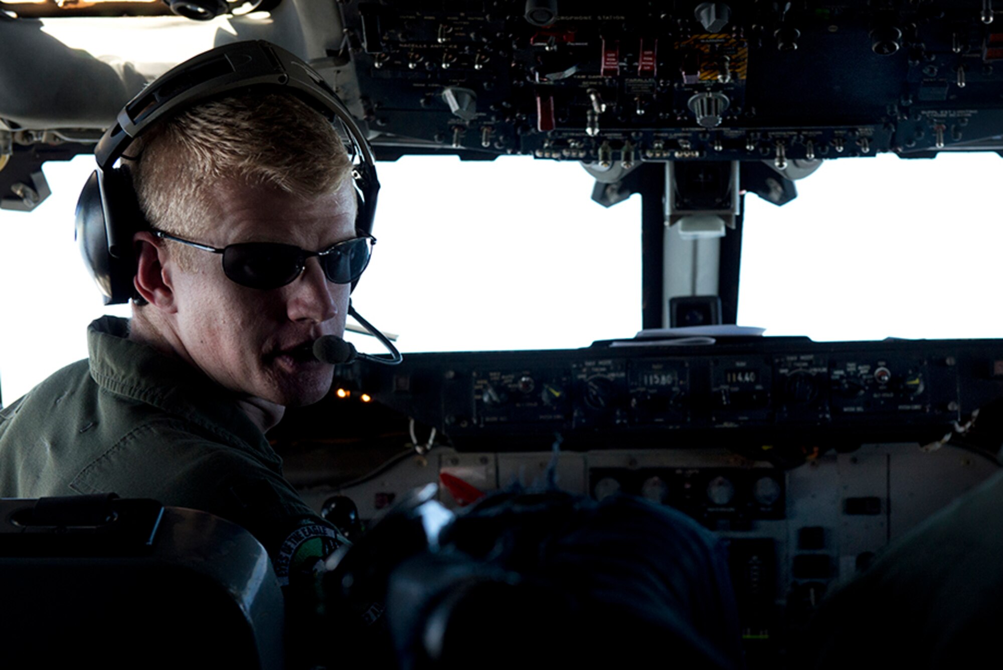 Air Force 1st Lieutenant Cassidy Sisto, an E-3 Sentry Airborne Warning and Control System pilot, leans back in his seat to talk to the flight engineer during the last Red Flag-Alaska 16-1 sortie May 12. Red Flag-Alaska is a Pacific Air Forces commander-directed field training exercises for U.S. and international forces that provides combined offensive counter-air, interdiction, close air support and large force employment training in a simulated combat environment. (U.S. Air Force photo by Senior Airman Kyle Johnson)
