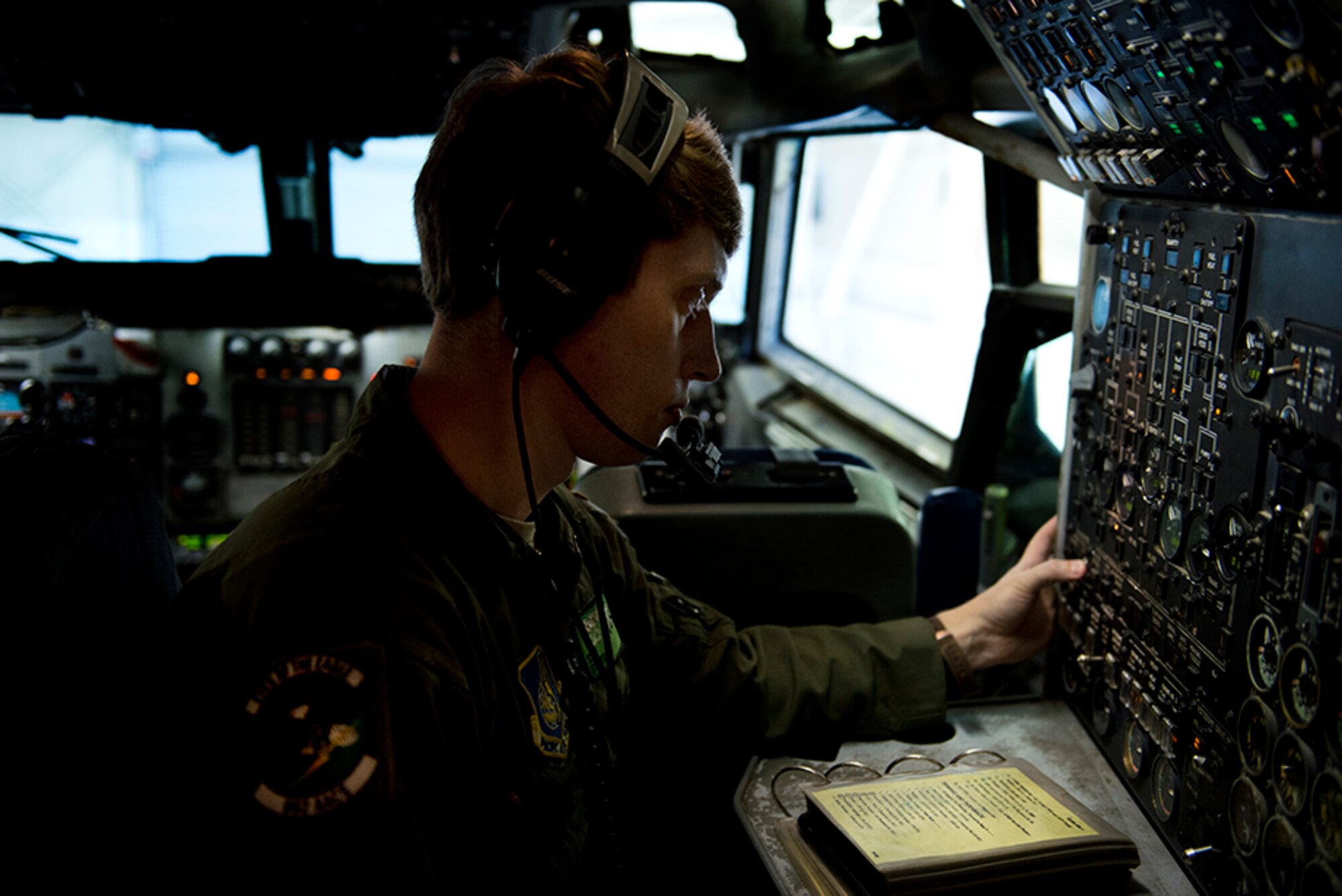 U.S. Air Force Staff Sgt. Kirk Riley, a 962nd Airborne Air Control Squadron flight engineer, performs pre-flight checks on an E-3 Sentry Airborne Warning and Control System while the rest of the crew performs their own individual checks before the final Red Flag 16-1 sortie May 12. Red Flag-Alaska is a Pacific Air Forces commander-directed field training exercises for U.S. and international forces that provides combined offensive counter-air, interdiction, close air support and large force employment training in a simulated combat environment. (U.S. Air Force photo by Senior Airman Kyle Johnson)