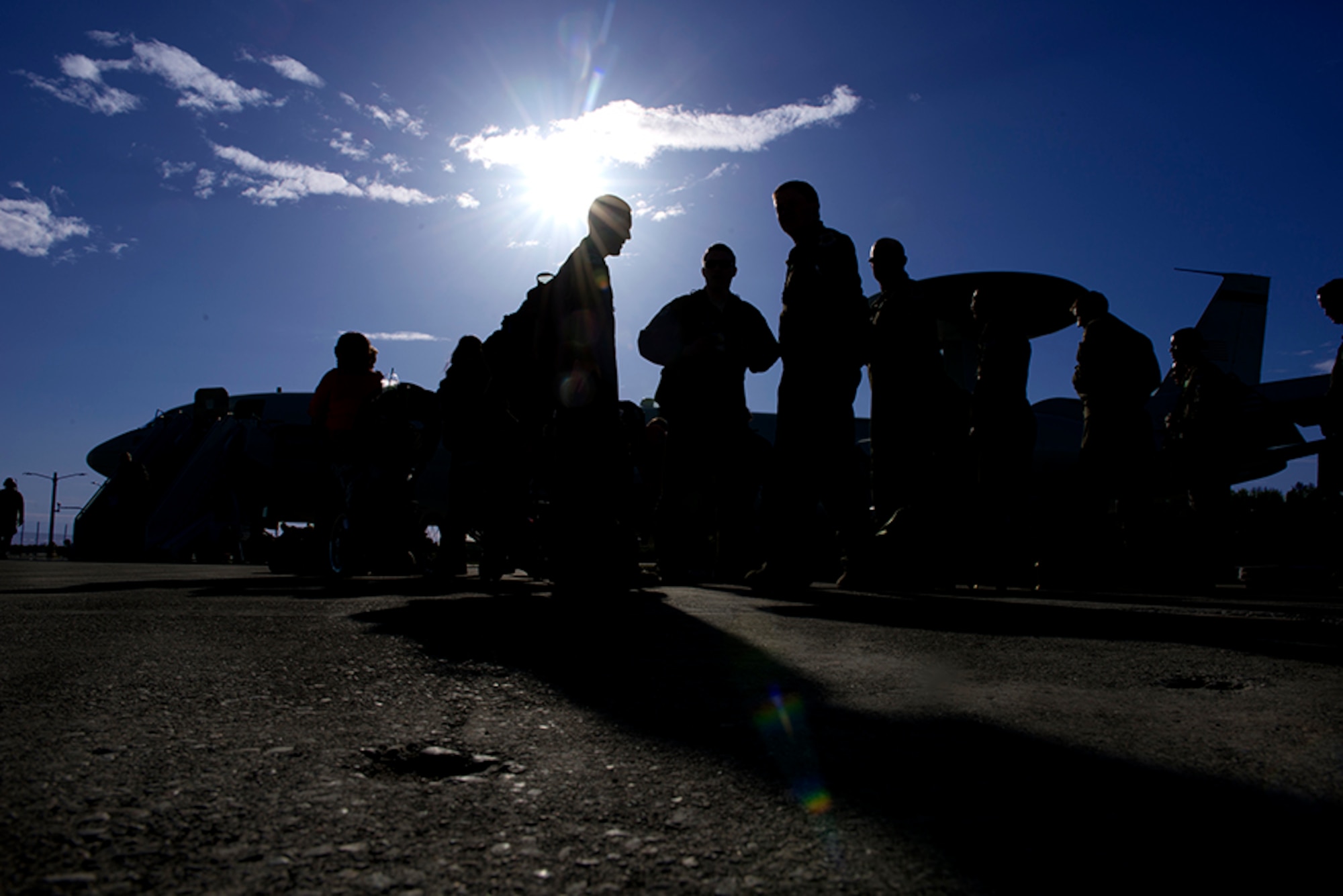 The crew of the  E-3 Sentry Airborne Warning and Control System for the last Red Flag-Alaska 16-1 sortie gather outside the aircraft on the Elmendorf flightline to celebrate the end of their flight, and the exercise before heading off to a debriefing, May 12.Red Flag-Alaska is a Pacific Air Forces commander-directed field training exercises for U.S. and international forces that provides combined offensive counter-air, interdiction, close air support and large force employment training in a simulated combat environment. (U.S. Air Force photo by Senior Airman Kyle Johnson)