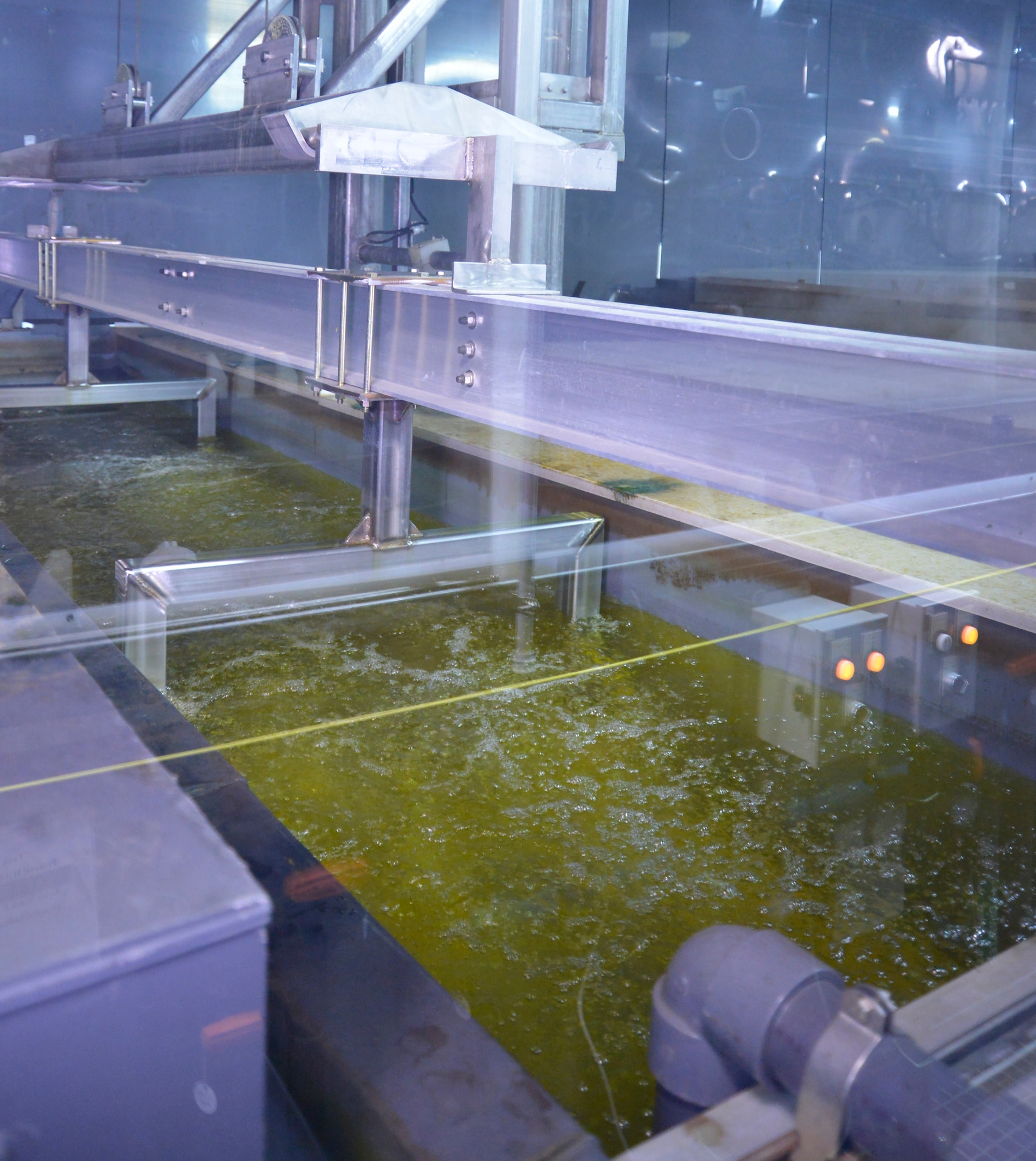 The 402nd Commodities Maintenance Group prepares aluminum components for the cleaning and conversion coating processes in Bldg. 20128. (U.S. Air Force photo by Ed Aspera)