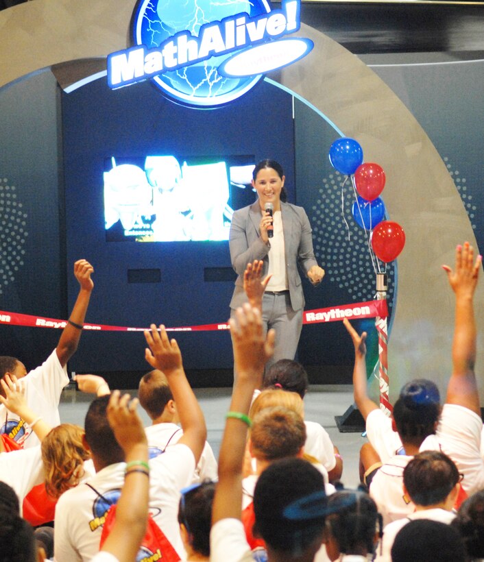 Barbara Borgonovi, Raytheon Space and Airborne Systems vice president of operations, makes remarks before opening the MathAlive! exhibit in the Century of Flight Hangar. (U.S. Air Force photo by Misuzu Allen)