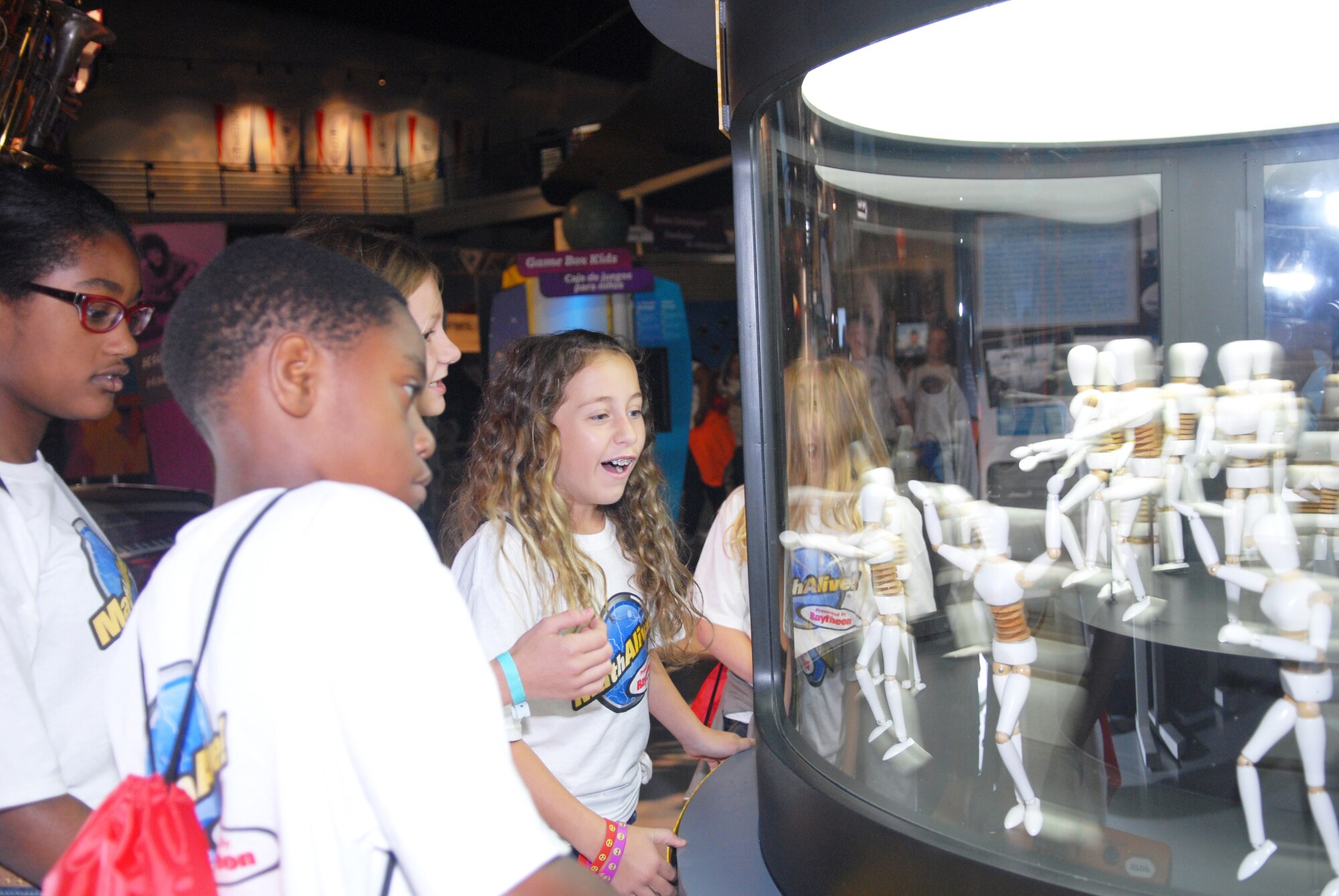 The fifth graders in Daughtry Elementary School in Jackson, Georgia, enjoy the Flicker Fusion interactive booth at the Museum of Aviation’s Century of Flight Hangar. The students learned that when light flashes more than 24 flashes per second, it is too fast for the human eye to see. (U.S. Air Force photo by Misuzu Allen)
