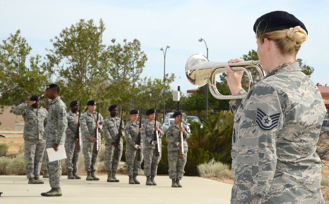 Tech. Sgt. Amanda Esparza, 412th Security Forces Squadron, plays Taps during a special retreat ceremony marking the end of Police Week. (U.S. Air Force photo by Christopher Ball.)