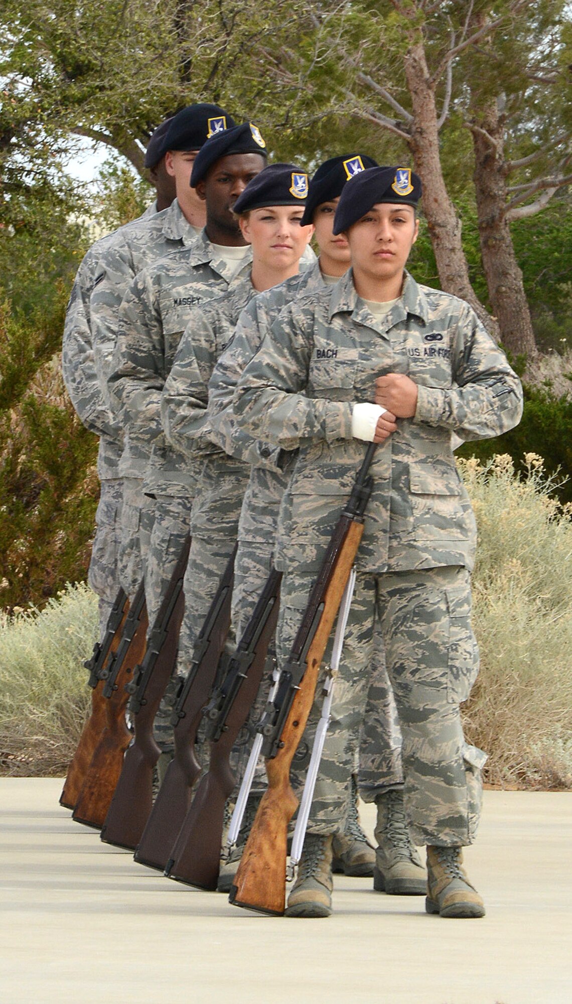 Members of the 412th Security Forces Squadron firing party stand by to render a 21-gun salute during a special retreat ceremony marking the end of Police Week. (U.S. Air Force photo by Christopher Ball.)