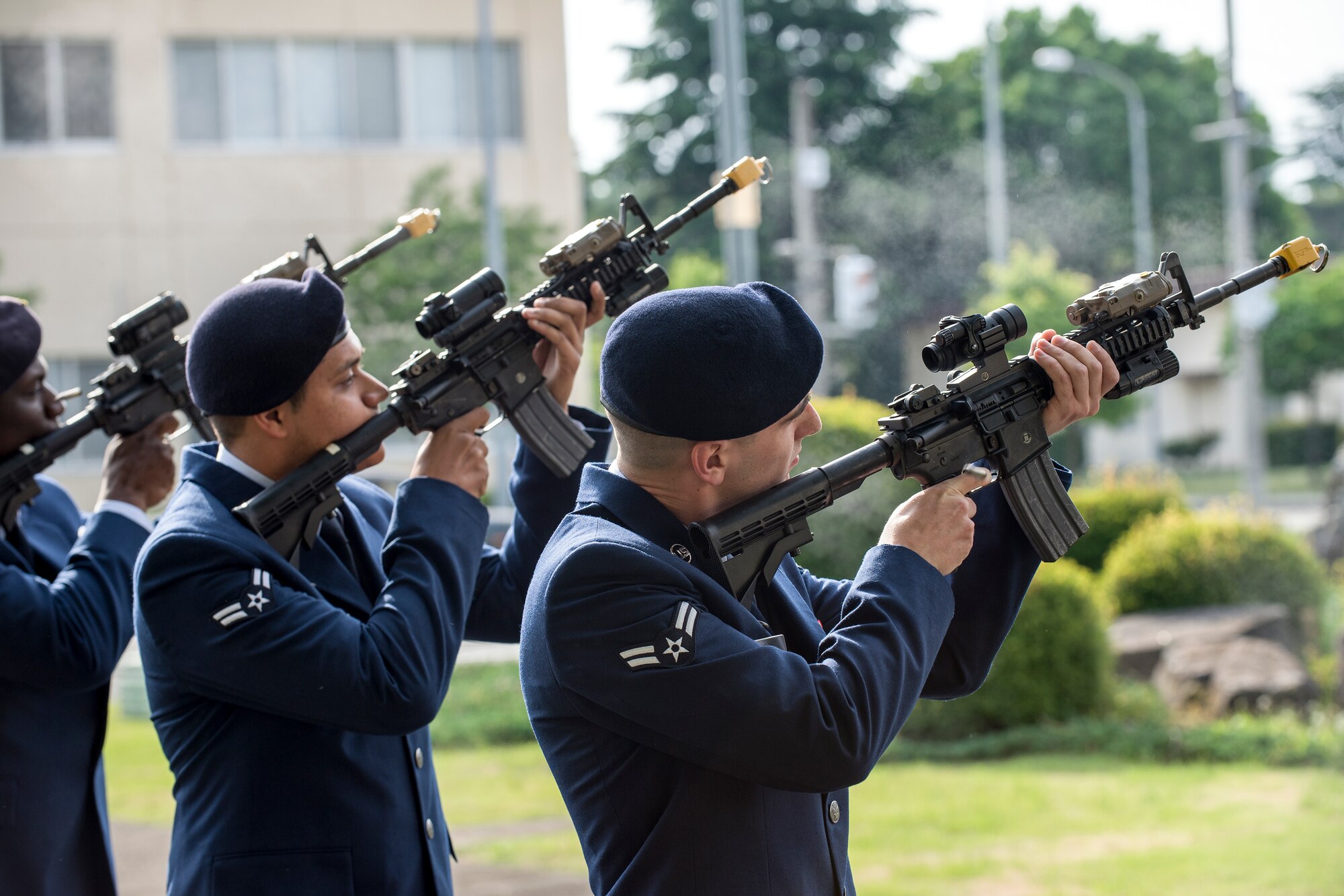 Defenders with the 374th Security Forces Squadron perform the gun salute during a retreat ceremony May 19, 2016 at Yokota Air Base, Japan. The security forces-lead ceremony wrapped up the squadron’s National Police Week activities while also, Yokota mourning their fallen Military Working Dog Alan/L220 recently passed away from cancer. (U.S. Air Force photo by Yasuo Osakabe/Released)
