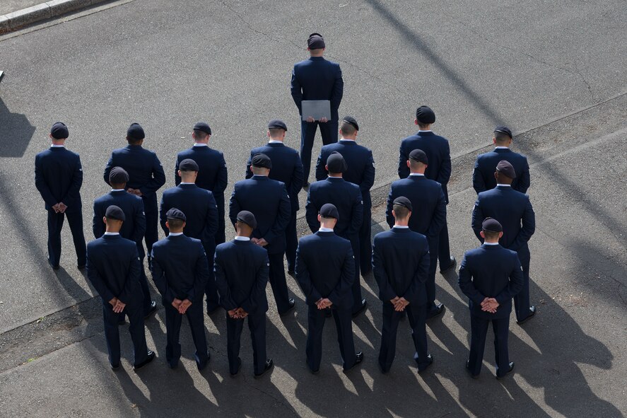 374th Security Forces Squadron defenders stand in formation for a retreat ceremony May 19, 2016 at Yokota Air Base, Japan. The ceremony was held during Police Week, which recognizes the service of law enforcement members and military working dogs who put their lives at risk every day. (U.S. Air Force photo by Yasuo Osakabe/Released) 