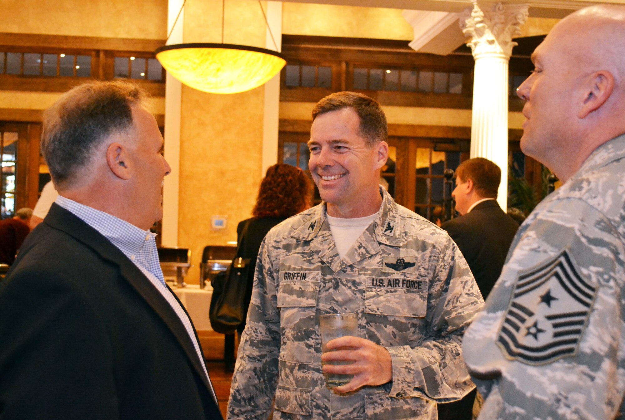 Col. William Griffin, the 111th Attack Wing vice commander, center, and Wing Command Chief Master Sgt. Paul Frisco Jr., both from Horsham Air Guard Station, Pa., talk with Kip McFatridge, an Upper Moreland Township commissioner, during the Willow Grove Chamber of Commerce Breakfast Meeting in Willow Grove, Pa., May 24, 2016. The meeting was attended by nearly 85 Willow Grove Chamber of Commerce members, local leaders, business owners, developers and community members, in addition to Airmen from Horsham AGS. (U.S. Air National Guard photo by Tech. Sgt. Andria Allmond)