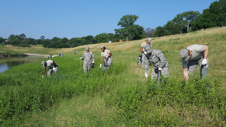 Airmen from the 136th Airlift Wing, Texas Air National Guard, stationed at the Naval Air Station Fort Worth Joint Reserve Base, helped clean up the community during participated in the annual Tarrant Regional Water District’s Spring Trash Bash, May 21, 2016. During the Trash Bash, more than 3,100 volunteers took part in picking up trash along the Trinity River. (Air National Guard photo by Senior Master Sgt. Elizabeth Gilbert/ released)