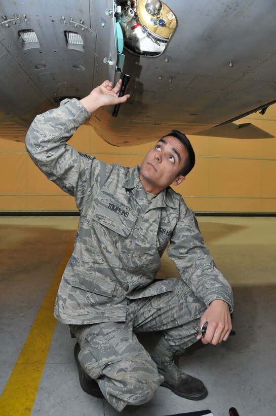 Staff Sgt. Trevor Tompkins of the Massachusetts Air National Guard, 104th Fighter Wing, inspects an F-15 Eagle aircraft during his daily preflight checks at Barnes Air National Guard Base. Tompkins was selected as the Continental U.S. North American Aerospace Control Alert Maintainer of the Year out of 16 ACA units throughout the Air Force. (U.S. Air National Guard photos by Master Sgt. Julie Avey) 