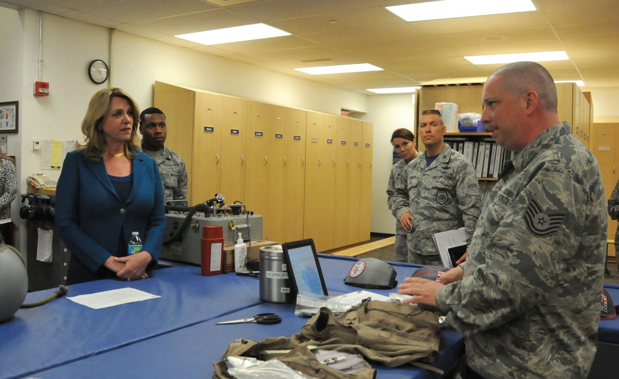JOINT BASE ANDREWS, Md. – Tech. Sgt. Matthew Kyler, 113th Operations Support Squadron aircrew flight equipment technician, answers questions from the Secretary of the Air Force Deborah Lee James during her tour of the 113th Wing May 20. Throughout her tour, James learned about the 113th Wing mission by engaging with Airmen in their various work areas. (U.S. Air National Guard photo by Senior Airman Erica Rodriguez)