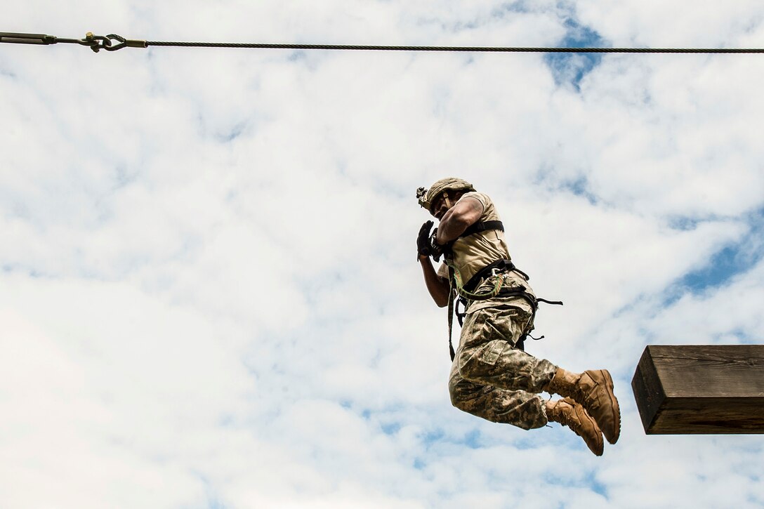 Army Sgt. Christian Hill jumps from an elevated obstacle during the 10th Army Air and Missile Defense Command’s 2016 Best Warrior Competition in Baumholder, Germany, May 17, 2016. Air Force photo by Tech. Sgt. Brian Kimball