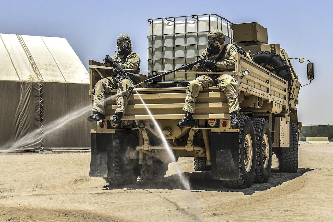 Soldiers perform chemical, biological, radiological and nuclear operations in full chemical gear at Camp Arifjan, Kuwait, May 18, 2016. The soldiers are assigned to 369th Chemical Company, an Army Reserves unit. Army photo by Sgt. 1st Class Marisol Walker