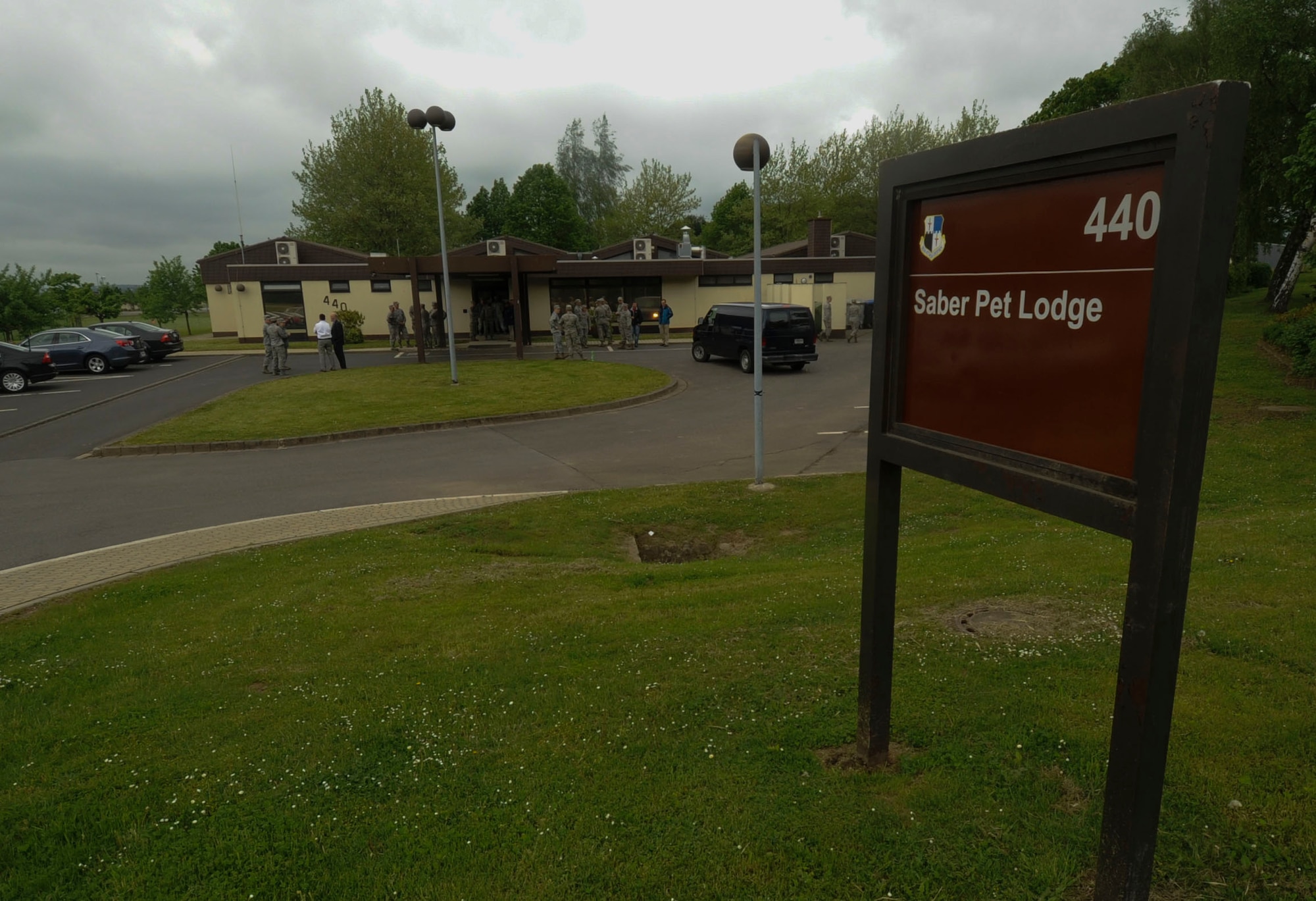Airmen assigned to the 52nd Fighter Wing visit after the opening ceremony of the Saber Pet Lodge at Spangdahlem Air Base, Germany, May 23, 2016. The lodge allows Sabers a facility where their pets can be watched and taken care of while they are away. (U.S. Air Force photo by Staff Sgt. Joe W. McFadden/Released)