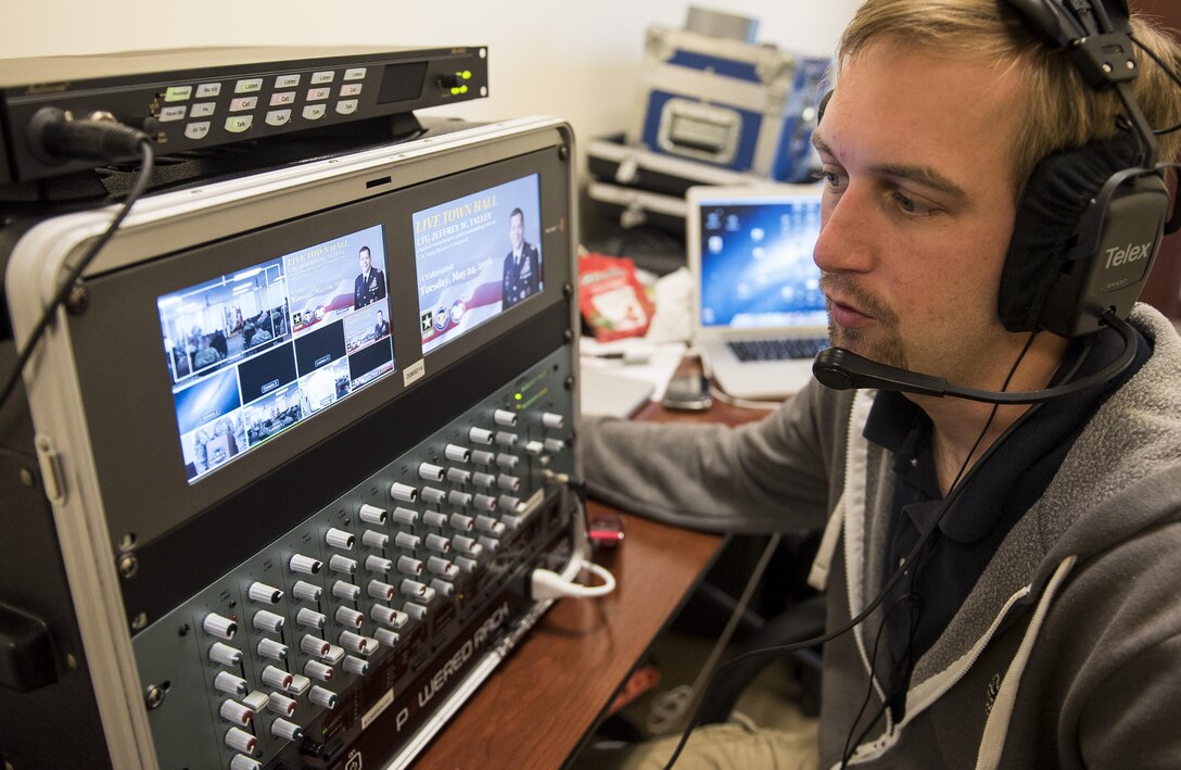 Calvin Reimold, senior video editor for the U.S. Army Reserve Command, monitors the audio and video input in preparation for an online broadcast of Lt. Gen. Jeffrey Talley, chief of the U.S. Army Reserve, as he conducts his final town hall meeting at Fort Belvoir, Virginia, May 24. During the meeting, Talley spoke on a variety of topics affecting the Army Reserve and answered questions from both the online and live audiences. (U.S. Army photo by Master Sgt. Michel Sauret)