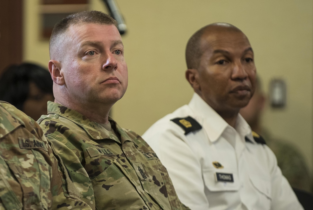 Command Sgt. Maj. James Wills, command sergeant major (CSM) of the U.S. Army Reserve, and Sergeant Maj. Luther Thomas, former CSM of the U.S. Army Reserve and current senior enlisted advisor to the assistant secreteary of defense for manpower and reserve affairs, listen to Lt. Gen. Jeffrey Talley, chief of the U.S. Army Reserve, as he speaks during his final town hall meeting at Fort Belvoir, Virginia, which was broadcasted live across the internet for viewers to participate from around the world, May 24. During the meeting, Talley spoke on a variety of topics affecting the Army Reserve and answered questions from both the online and live audiences. (U.S. Army photo by Master Sgt. Michel Sauret)