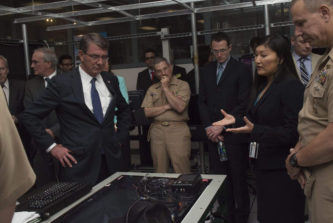 Defense Secretary Ash Carter, left, receives a briefing on the capabilities of Advanced Weapons Enhanced by Submarine UAS against Mobile targets, known as Awesum, during a visit to the Naval Undersea Warfare Center in Newport, R.I., May 25, 2016. DoD photo by Air Force Senior Master Sgt. Adrian Cadiz