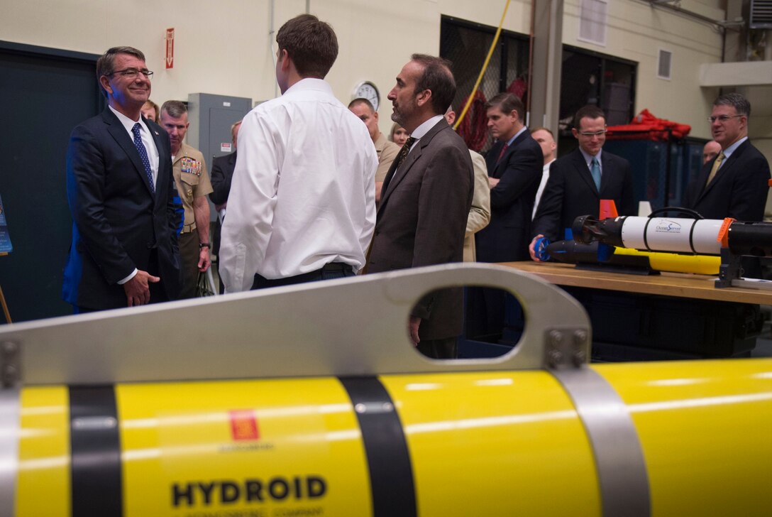 Defense Secretary Ash Carter, left, receives a briefing on unmanned underwater vehicle capabilities during a visit to the Naval Undersea Warfare Center in Newport, R.I., May 25, 2016. DoD photo by Air Force Senior Master Sgt. Adrian Cadiz