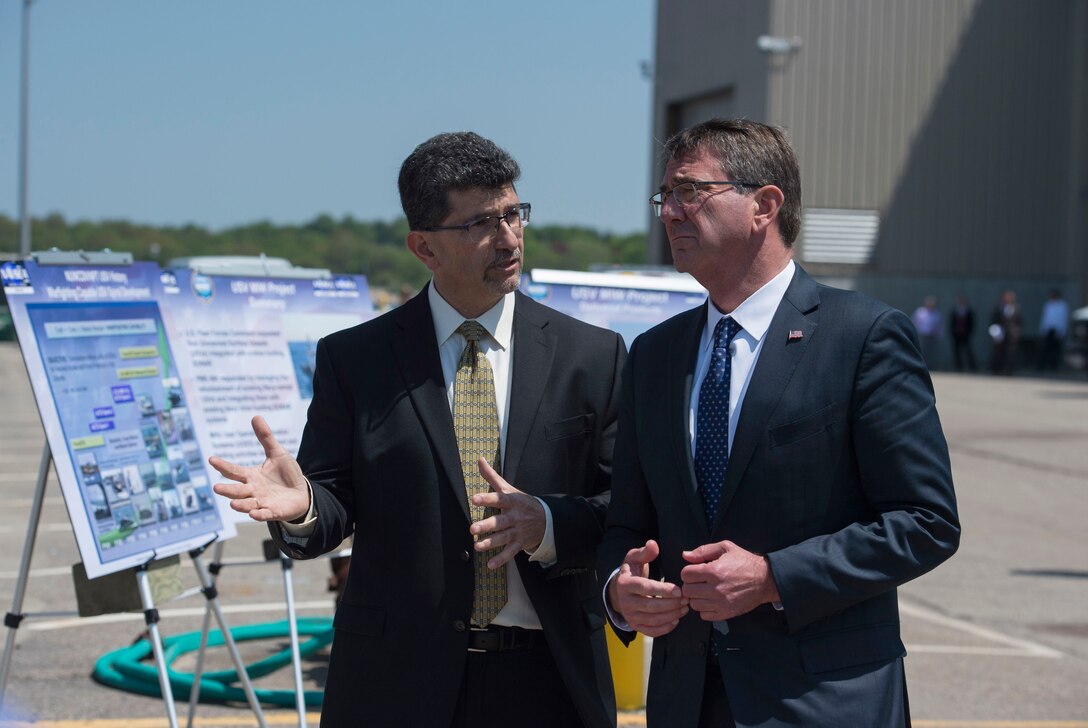 Defense Secretary Ash Carter, right, receives a briefing on unmanned surface vehicles from George Maris, a division heat at Naval Undersea Warfare Center in Newport, R.I., May 25, 2016. DoD photo by Air Force Senior Master Sgt. Adrian Cadiz