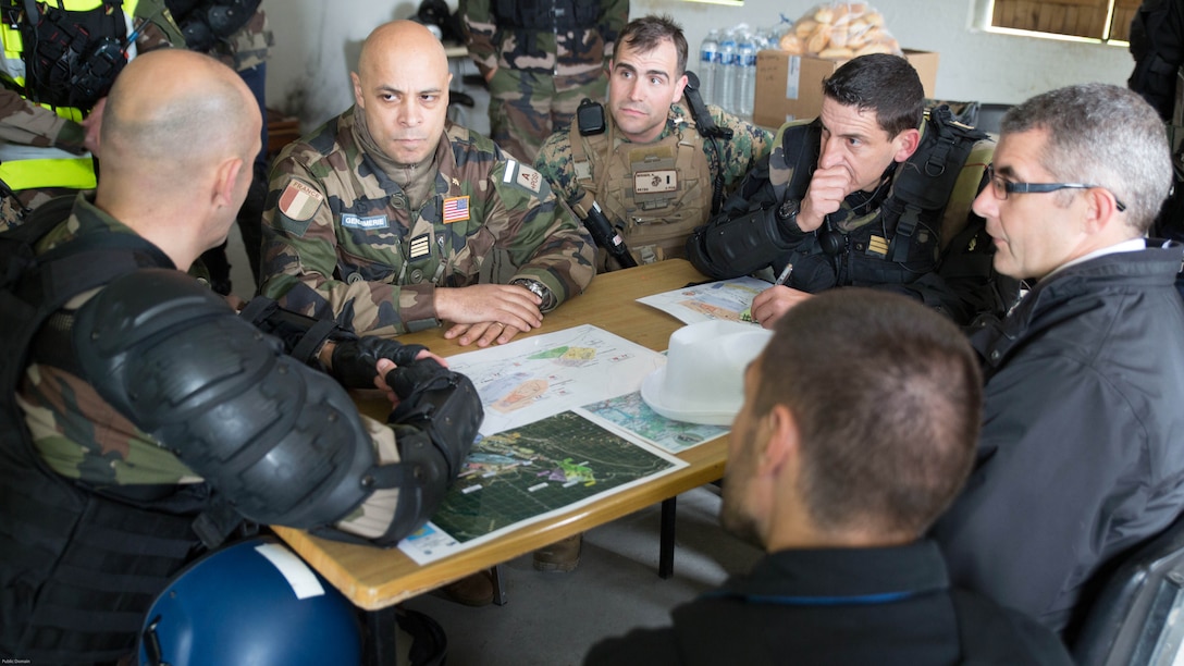 Leaders with Special Purpose Marine Air-Ground Task Force-Crisis Response-Africa and the French National Gendarmerie meet as representatives for the simulated U.S. and French Embassies during a riot-control exercise at the National Gendarmerie Training Center in St. Astier, France, May 13, 2016. This exercise helped reinforce the strong relationship between the United States and France and prepare the Marines and Gendarmes to work together in possible real-world scenarios at embassies around Europe and Africa. 