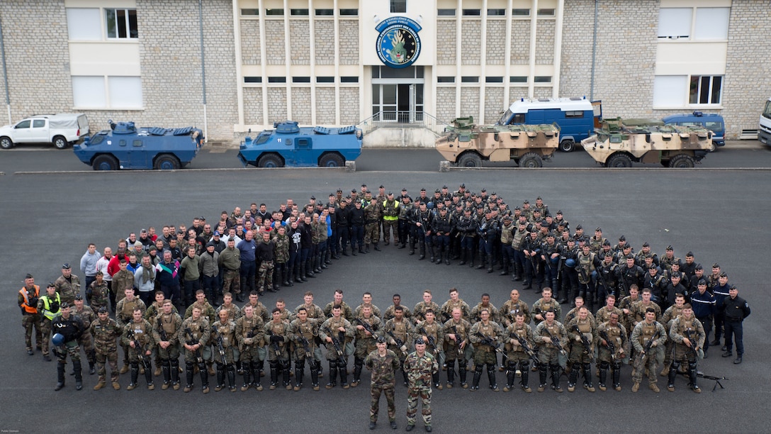 U.S. Marines with Special Purpose Marine Air-Ground Task Force-Crisis Response-Africa pose with members of the French National Gendarmerie for a group photo at the conclusion of a bilateral riot-control exercise with U.S. Marines at the National Gendarmerie Training Center in St. Astier, France, May 13, 2016. This exercise helped reinforce the strong relationship between the United States and France and prepare the Marines and Gendarmes to work together in possible real-world scenarios at embassies around Europe and Africa. 