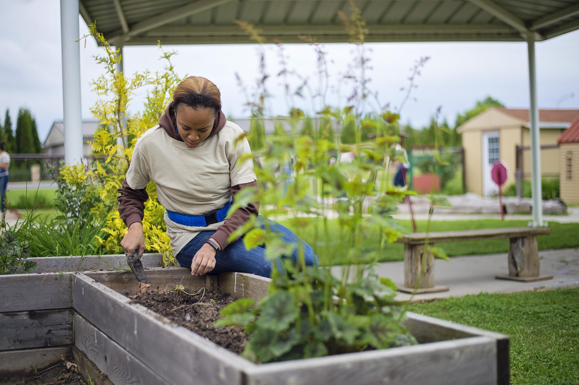 Members of the 512th Airlift Wing's Developmental & Training Flight clean up the playground at the Child Development Center on Dover Air Force Base, Del., May 21, 2016, during the wing's Unit Training Assembly. The D&TF is a unit that trains future reservists on what to expect during Basic Military Training and an overview of Air Force culture. (U.S. Air Force photo/Capt. Bernie Kale)