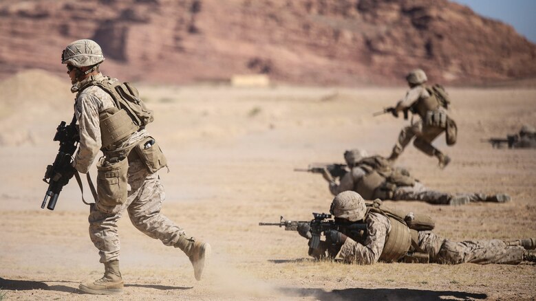 Marines with 1st Battalion, 2nd Marine Regiment, 2nd Marine Division advance down range during a squad attacks exercise in Al Quweyrah, Jordan, May 19, 2016. Eager Lion is a recurring exercise between partner nations designed to strengthen military-to-military relationships, increase interoperability, and enhance regional security and stability. 