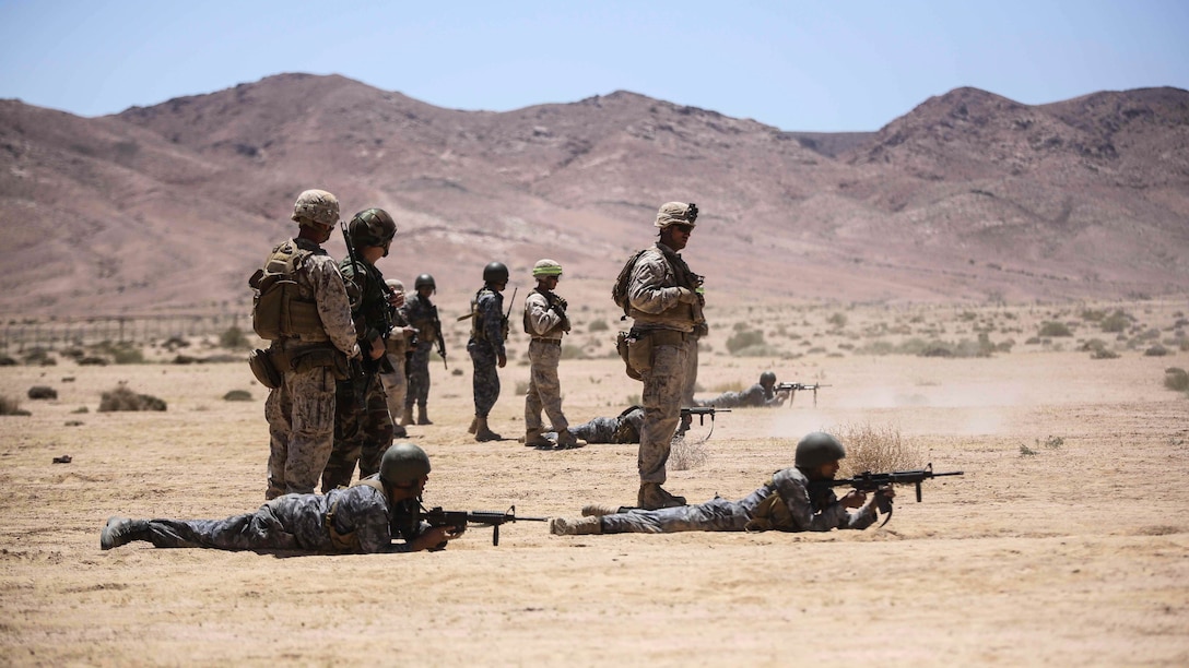 Members of the Jordanian 77th Marines Battalion engage targets during a squad attacks exercise in Al Quweyrah, Jordan, May 19, 2016. Eager Lion is a recurring exercise between partner nations designed to strengthen military-to-military relationships, increase interoperability, and enhance regional security and stability.