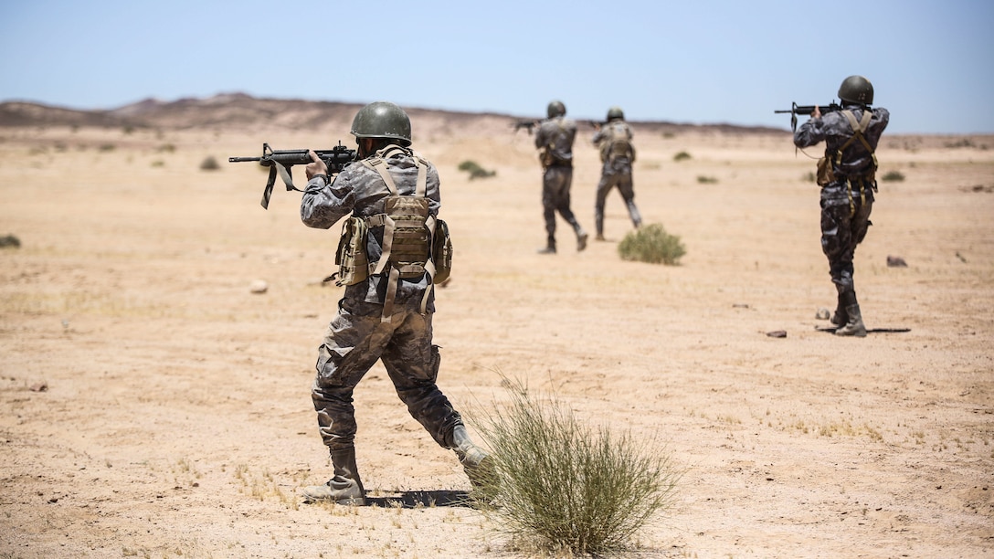 Members of the Jordanian 77th Marines Battalion engage targets during a squad attacks exercise in Al Quweyrah, Jordan, May 19, 2016. Eager Lion is a recurring exercise between partner nations designed to strengthen military-to-military relationships, increase interoperability, and enhance regional security and stability. 