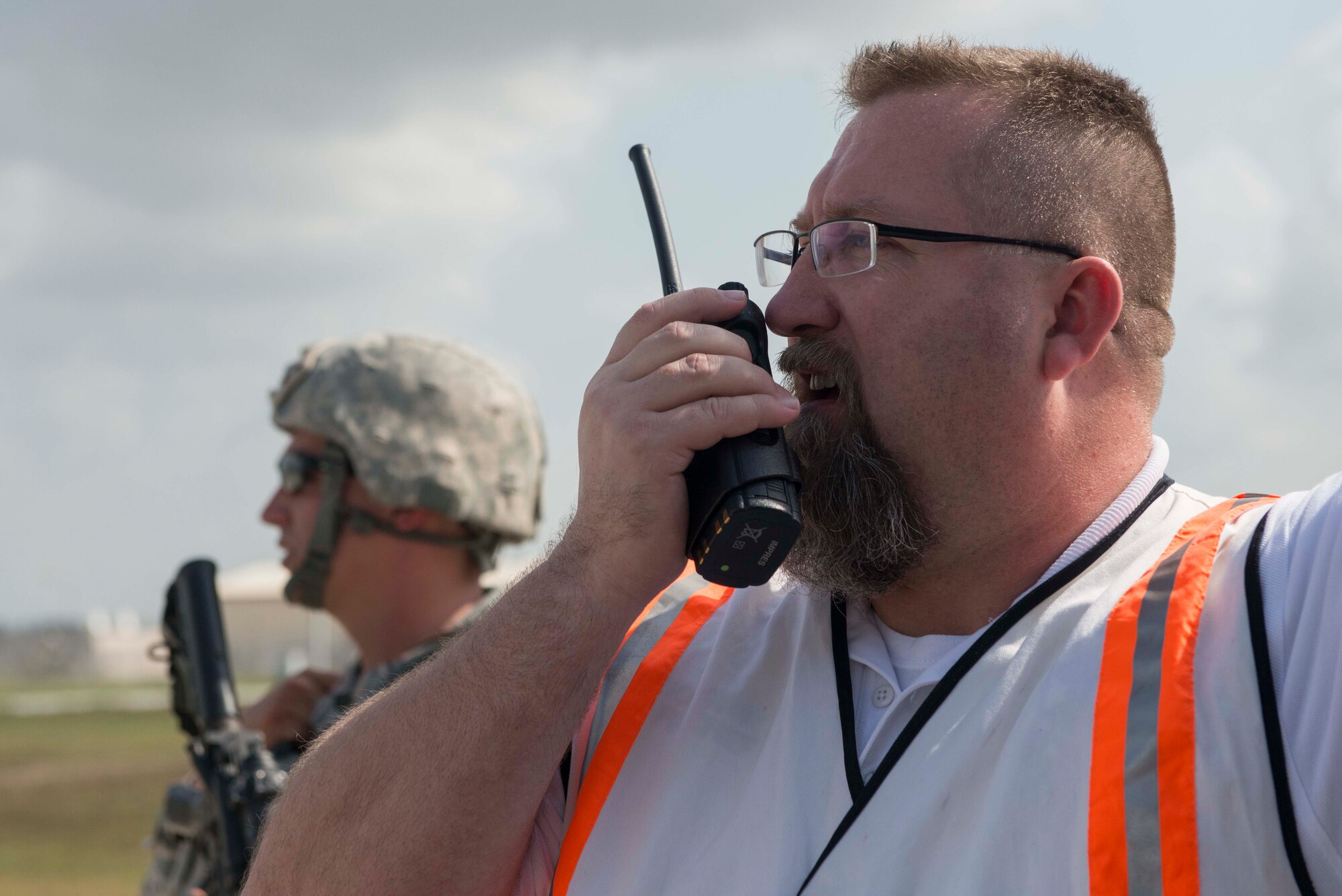Rusty Thomason, 39th Civil Engineer Squadron assistant fire chief, communicates with Airmen responding in an exercise May 18, 2016, at Incirlik Air Base, Turkey. Thomason’s role for the exercise was the on-scene commander, which directed the flow of operations. (U.S. Air Force photo by Senior Airman John Nieves Camacho/Released)