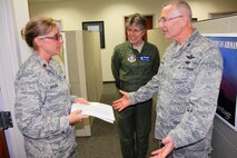 Maj. Emily Stuckey of the 932nd Airlift Wing, 932nd Medical Squadron, meets the new 932nd Airlift Wing commander, Col. Jonathan Philebaum, as part of many activities during the May Unit Training Assembly, May 1, 2016, at Scott Air Force Base, Illinois. Philebaum met with several Airmen, like Stuckey and her commander Col. Meredith Goodwin (center), during his immersion tour over the several unit training assembly weekends. Philebaum visited the various sections within wing's staff agencies and learned more about each individual and their jobs within the 932nd AW. (U.S. Air Force photo by Maj. Stan Paregien) 