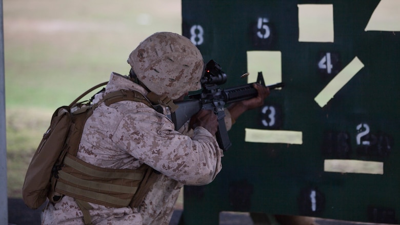 Sgt. Jacques Yves Duroseau fires rounds through a barricade at Puckapunyal Military Area, Victoria, Australia, May 11, 2016. Duroseau competed with the Marine Corps Shooting Team in the Australian Army Skill at Arms Meeting 2016, a multinational event that evaluated military marksmen’s skill with firearms against their peers.  During the barricade match, shooters had to fire through 12 points on a barricade in order to hit their targets.