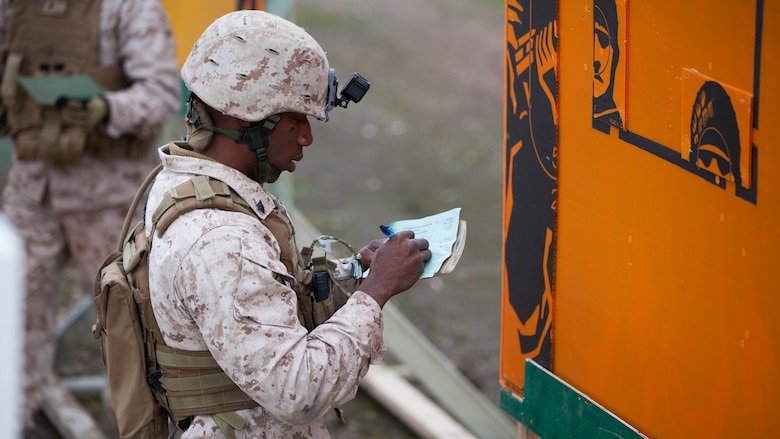 Sgt. Jacques Yves Duroseau grades a competitor’s score after the barricade match at Puckapunyal Military Area, Victoria, Australia, May 11, 2016. Duroseau competed with the Marine Corps Shooting Team in the Australian Army Skill at Arms Meeting 2016, a multinational event that evaluated military marksmen’s skill with firearms against their peers.