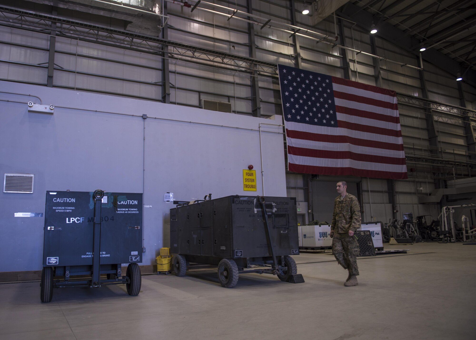 Senior Airman Craig Martin, 455th Expeditionary Aircraft Maintenance Squadron fuels system specialist, walks towards equipment storage at Bagram Airfield, Afghanistan, May 24, 2016. Martin inspects fuel cells and tanks for foreign objects, corrosion, cell deterioration and fungus. (U.S. Air Force photo by Senior Airman Justyn M. Freeman)