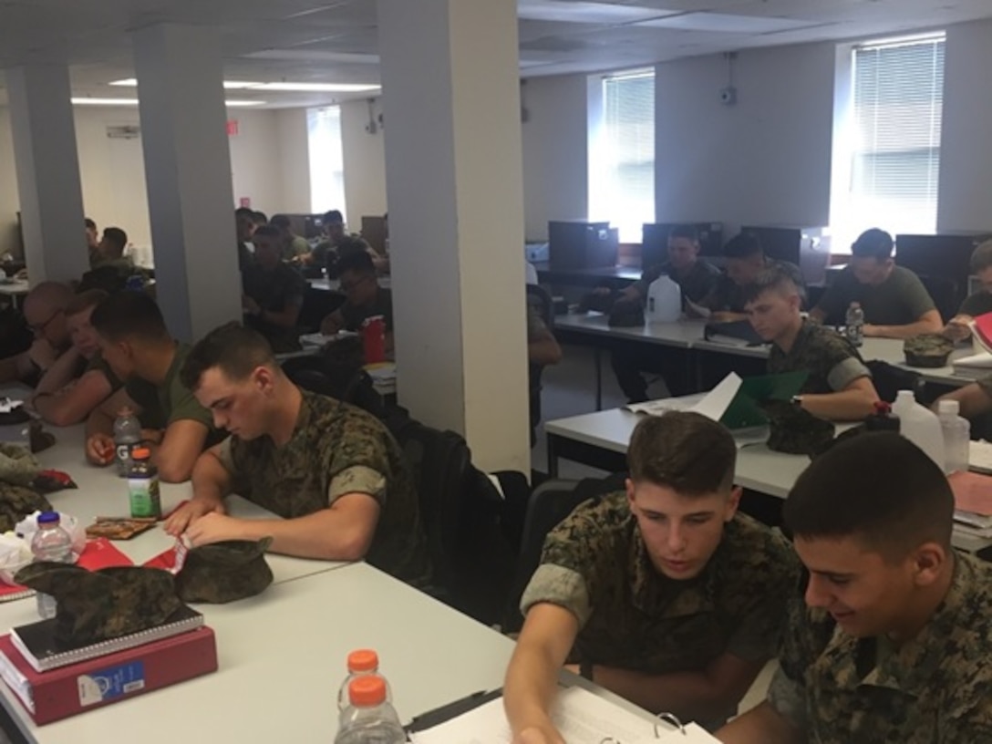Marines attending Basic Engineer Equipment Electrical Systems Technician course 5-16 (BEEEST 5-16), at Marine Corps Engineer School aboard Camp Lejeune, N.C.; review their student outlines before receiving a class on solid state devices.
