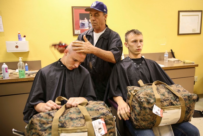 Recruits of Alpha Company, 1st Recruit Training Battalion, receive their initial haircut at Marine Corps Recruit Depot San Diego, May 23. Recruits receive haircuts immediately after arriving to create uniformity. Annually, more than 17,000 males recruited from the Western Recruiting Region are trained at MCRD San Diego. Alpha Company is scheduled to graduate Aug. 19.