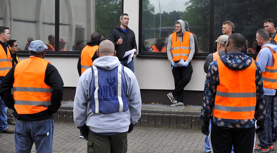 Master Sgt. Edwin Colon, center, U.S. Air Forces in Europe Inspector General demand intelligence inspector, talks to volunteers before an off-base clean-up event May 20, 2016, at Ramstein Air Base, Germany. This particular event is the first one and was planned by USAFE Top 3 and ensures Kaiserslautern Military Community members help preserve the German ecosystem. (U.S. Air Force photo/Senior Airman Larissa Greatwood)