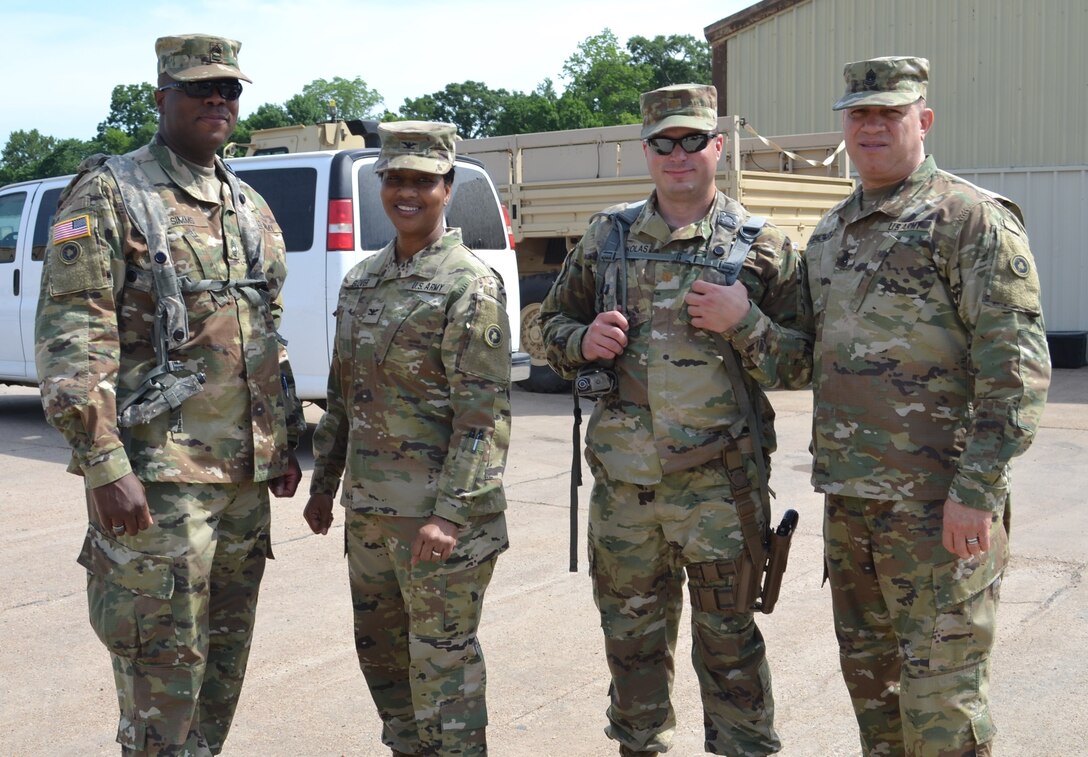Master Sgt. Ricky Simms, 314th Combat Sustainment Support Command sergeant major, Col. Toni Glover, 650th Regional Support Group commanding officer, Maj. Leopold Karanikolas, 314th CSSB commander, and Command Sgt. Maj. Mario Canizales, 650th RSG command sergeant major, meet at Fort Polk during Joint Readiness Training Center exercises May 7, where units from the U.S. Army National Guard, Army Reserve and active-duty Army train together.